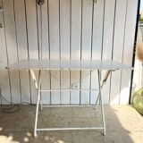 White folding metal bistro table