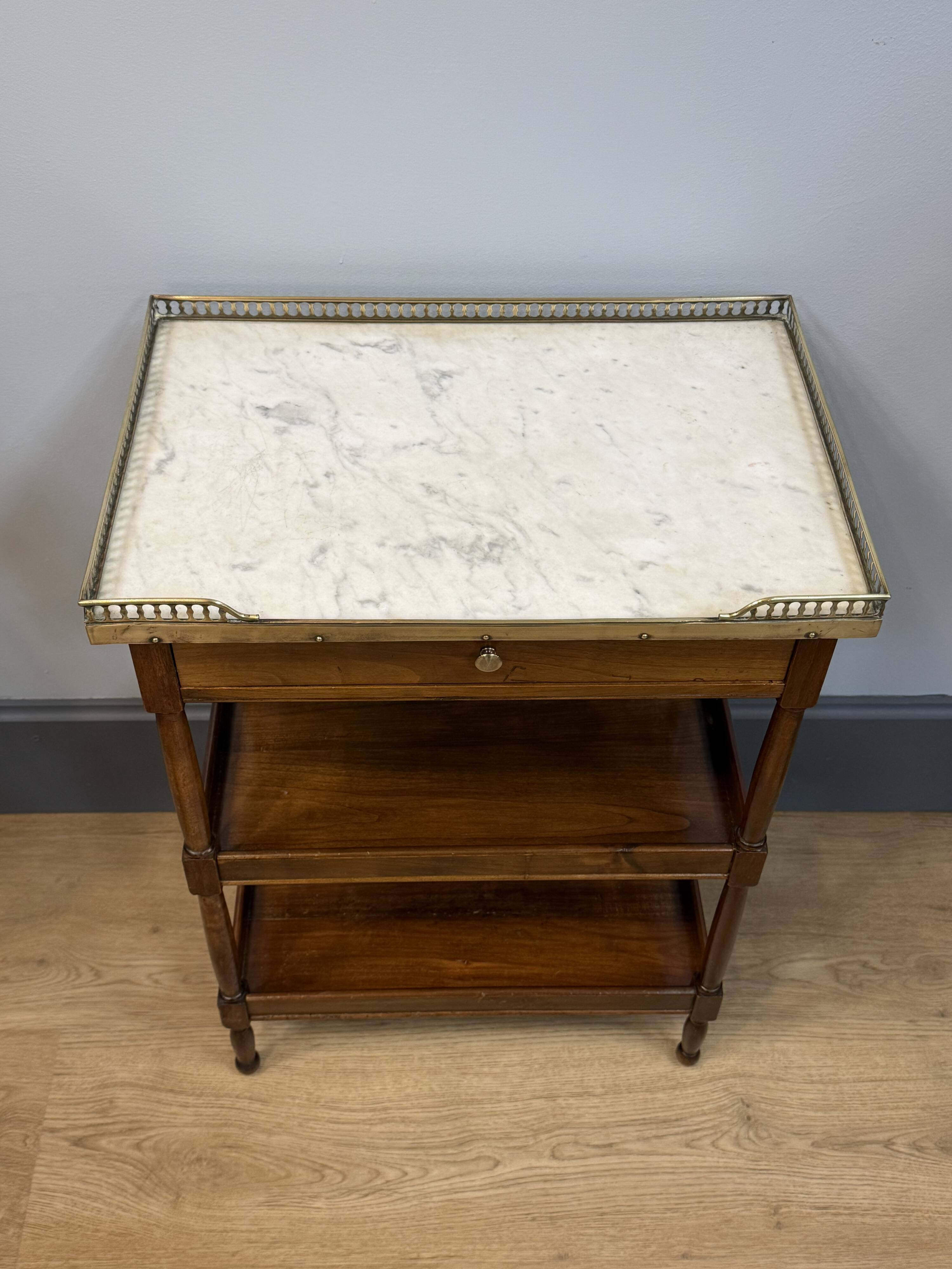 Small mahogany side table in Louis XVI style.