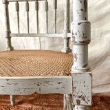 19th-century corner fireplace armchair, wood and cane.