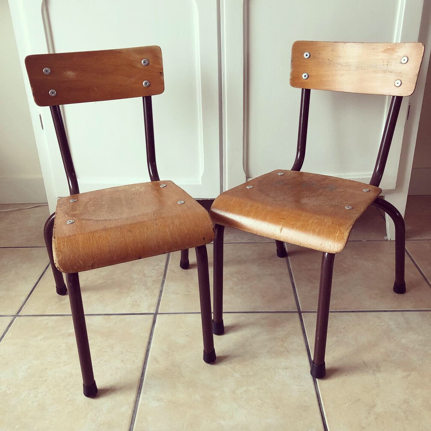 Duo of brown child school chairs