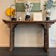 Chinese console in ancient elm, carved openwork legs and top g