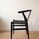 Set of 4 vintage Scandinavian Wishbone style chairs in black wood.