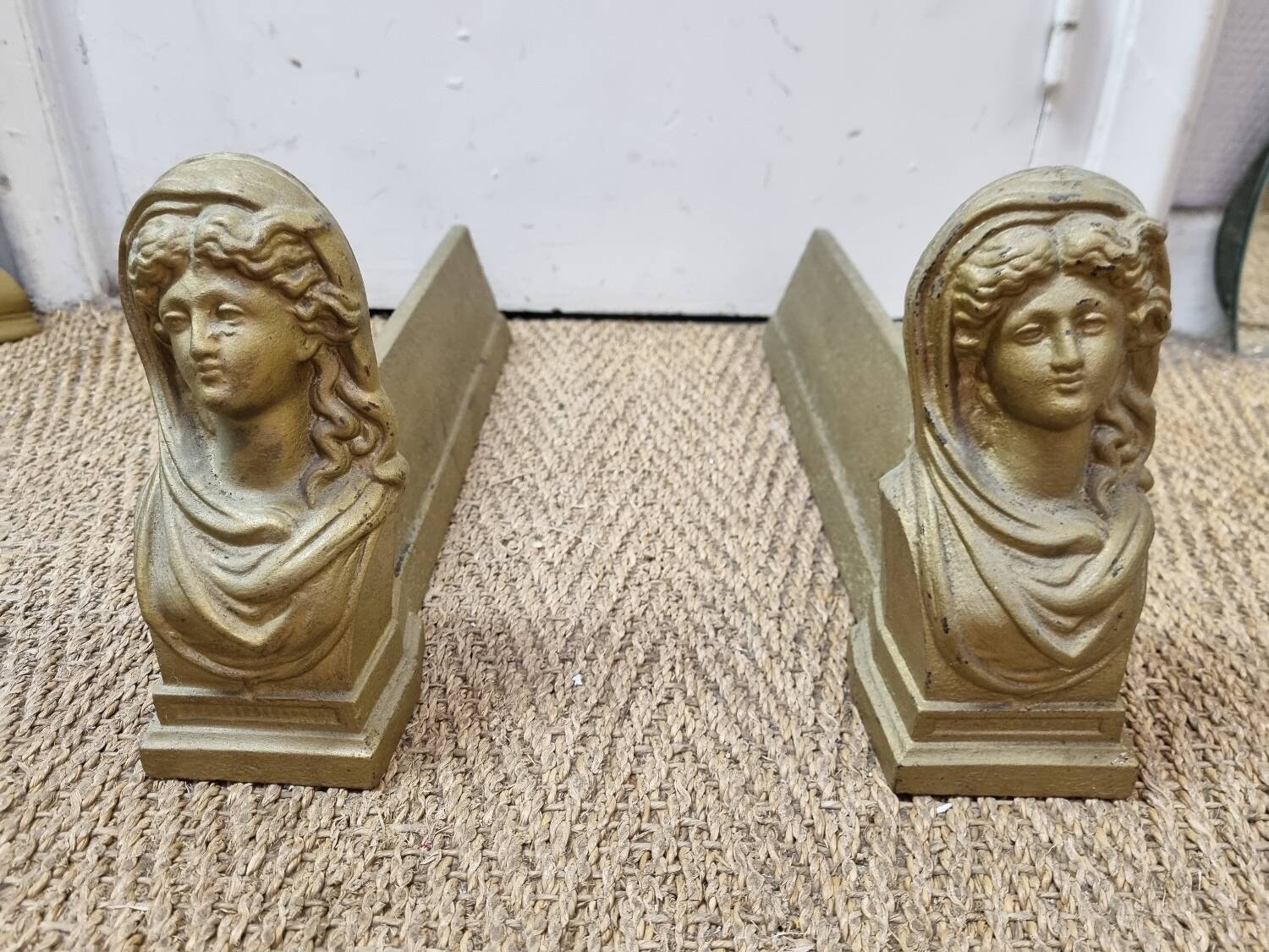 Cast iron andirons heads of women