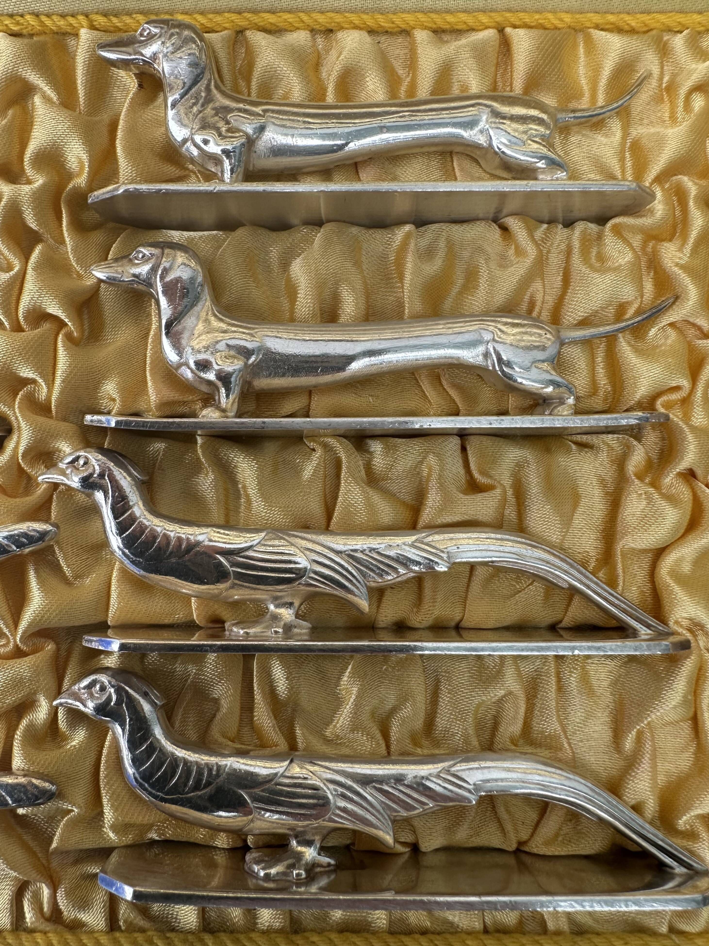 12 antique silver-plated bronze knife rests in modern art deco animal designs.