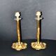 Lot of 2 antique brass and gilded bronze candle holders with acanthus decoration.