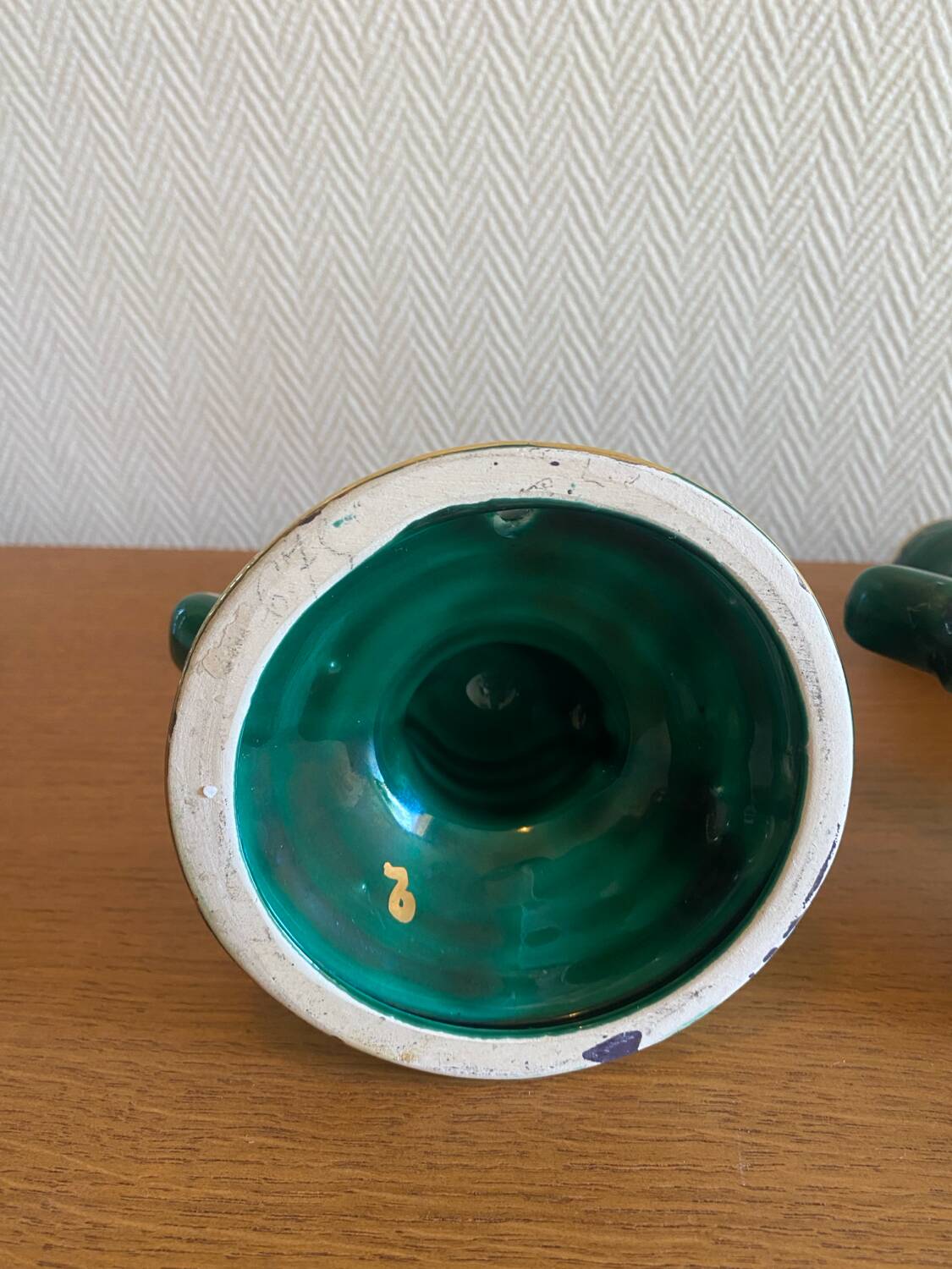 Pair of green and gold ceramic candlesticks