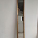 Long wooden mirror and gilded stucco with pearl rays H: 2m45 L: 40cm