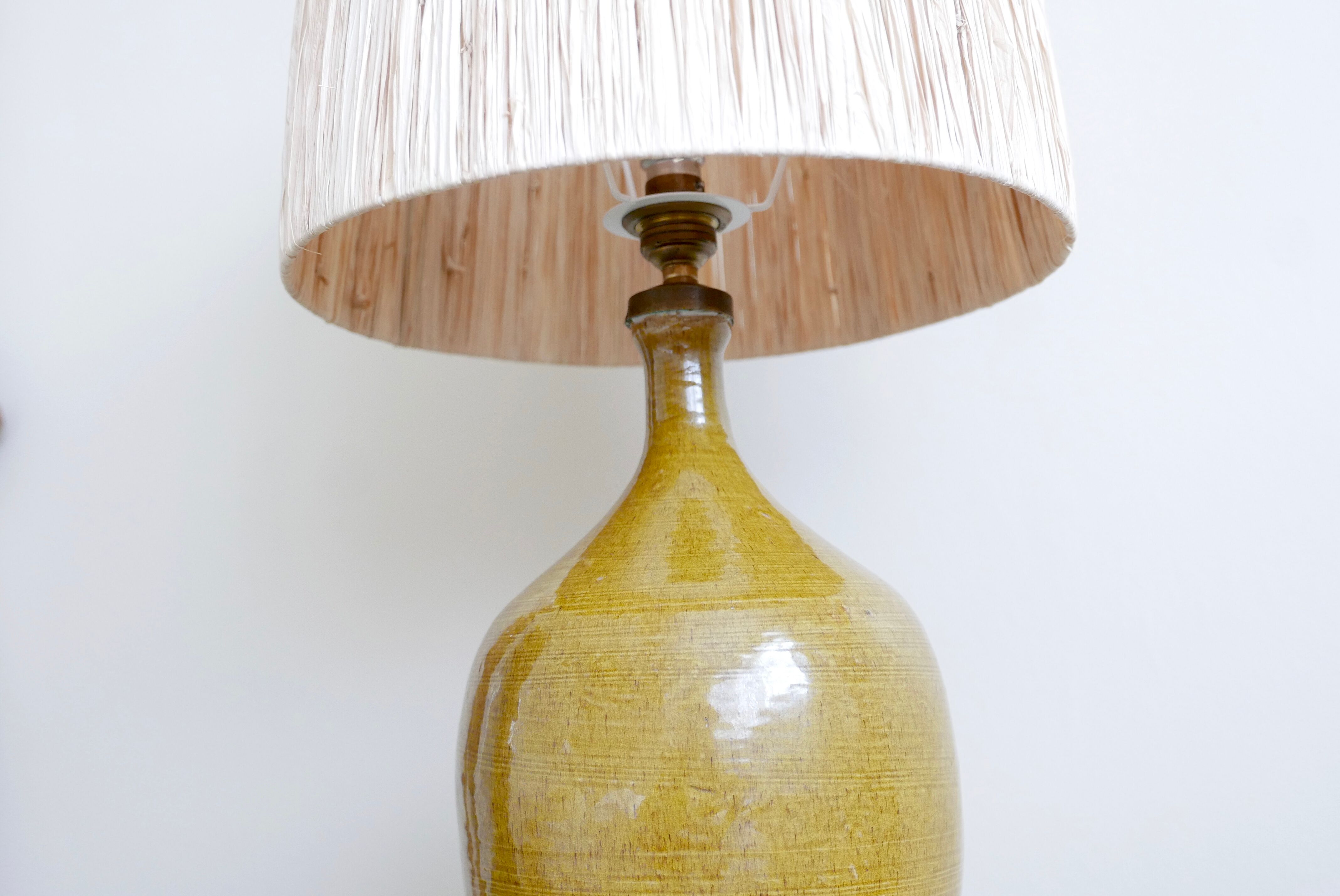 Aniseed green ceramic pottery lamp, raffia lampshade, 70s