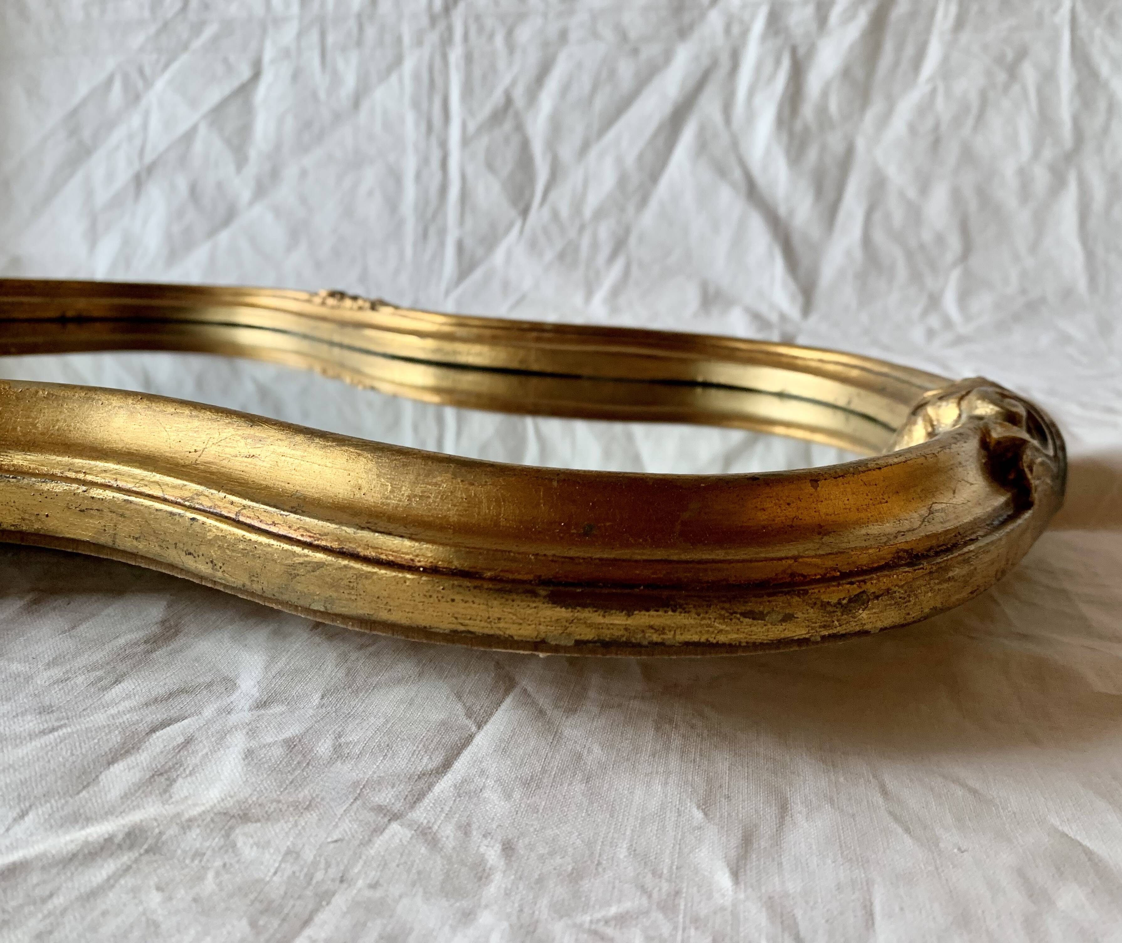 Large rococo mirror in gilded wood