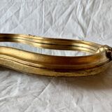 Large rococo mirror in gilded wood
