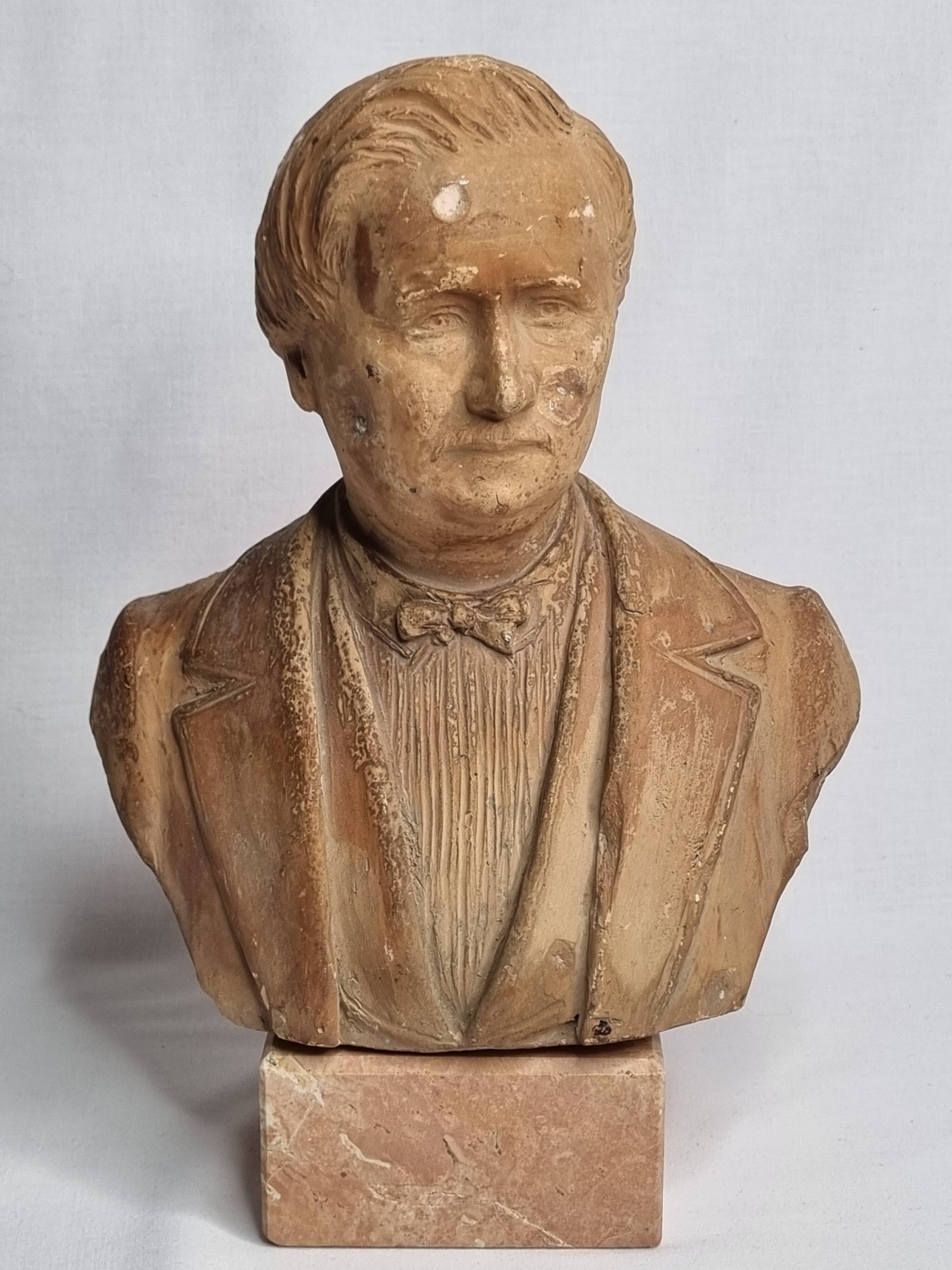 Bust of a notable in terracotta, 29 cm, signed Pasquet, 1870, on a base.