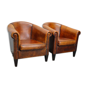 Paire de fauteuils club vintage en cuir cognac