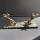 Pair of art deco marble and patinated regulated bookends