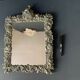 Antique Italian mirror in repoussé silver metal