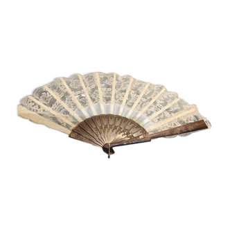 Old lace fan with mother-of-pearl sticks.