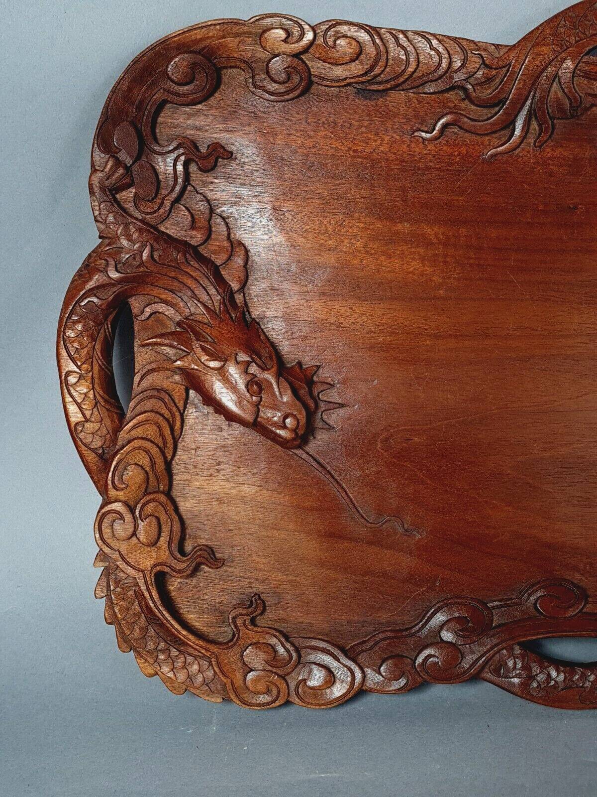 Ancient wooden tray carved with Chinese dragons around 1900