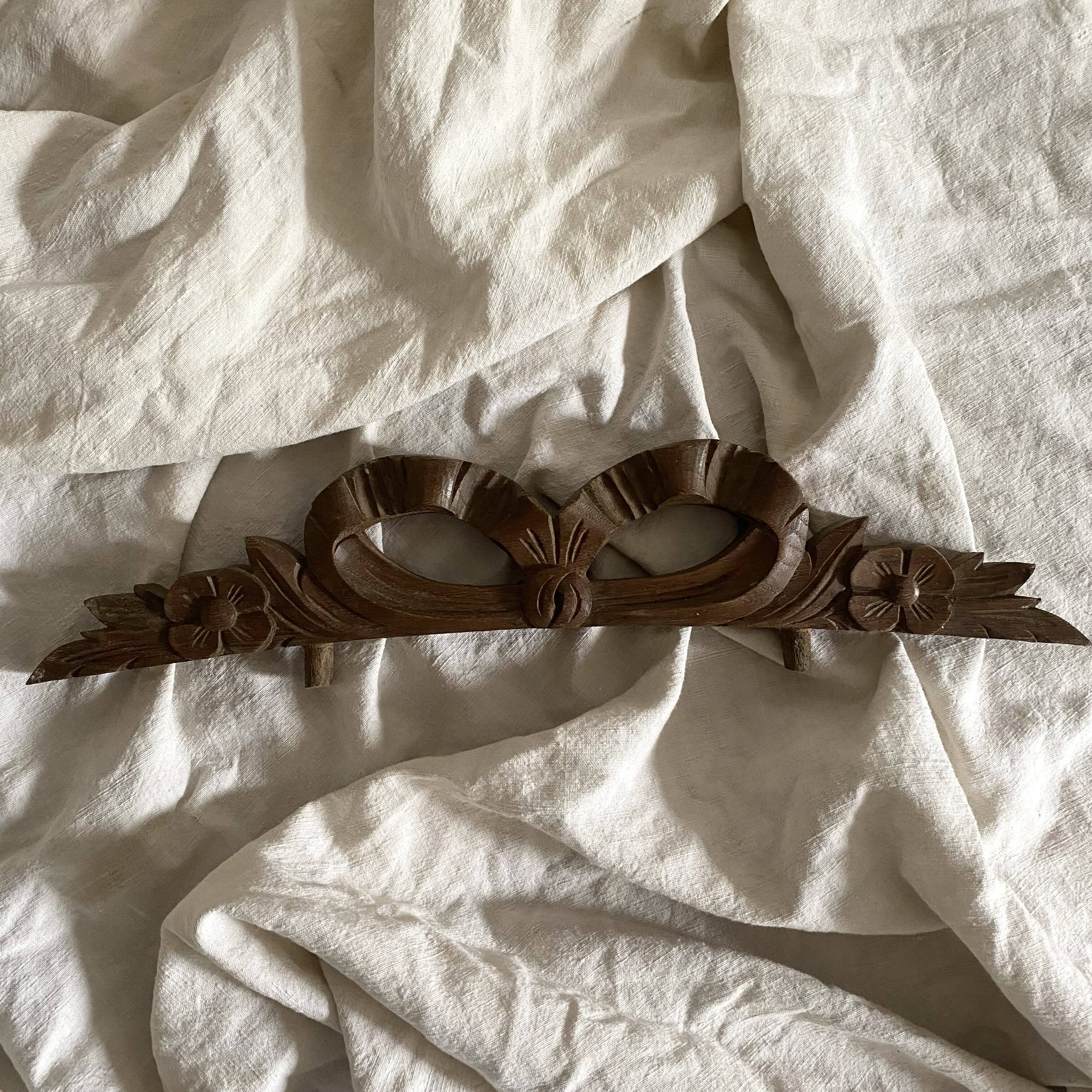 Antique carved wooden ribbon pediment