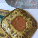 Set of three potter's plates in enamelled earth