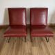 Paire de fauteuils vintage rouge bordeaux