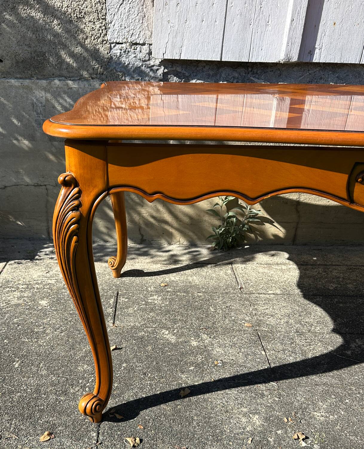 Antique extendable table in cherry wood and marquetry in the Louis XV style.