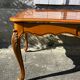 Antique extendable table in cherry wood and marquetry in the Louis XV style.