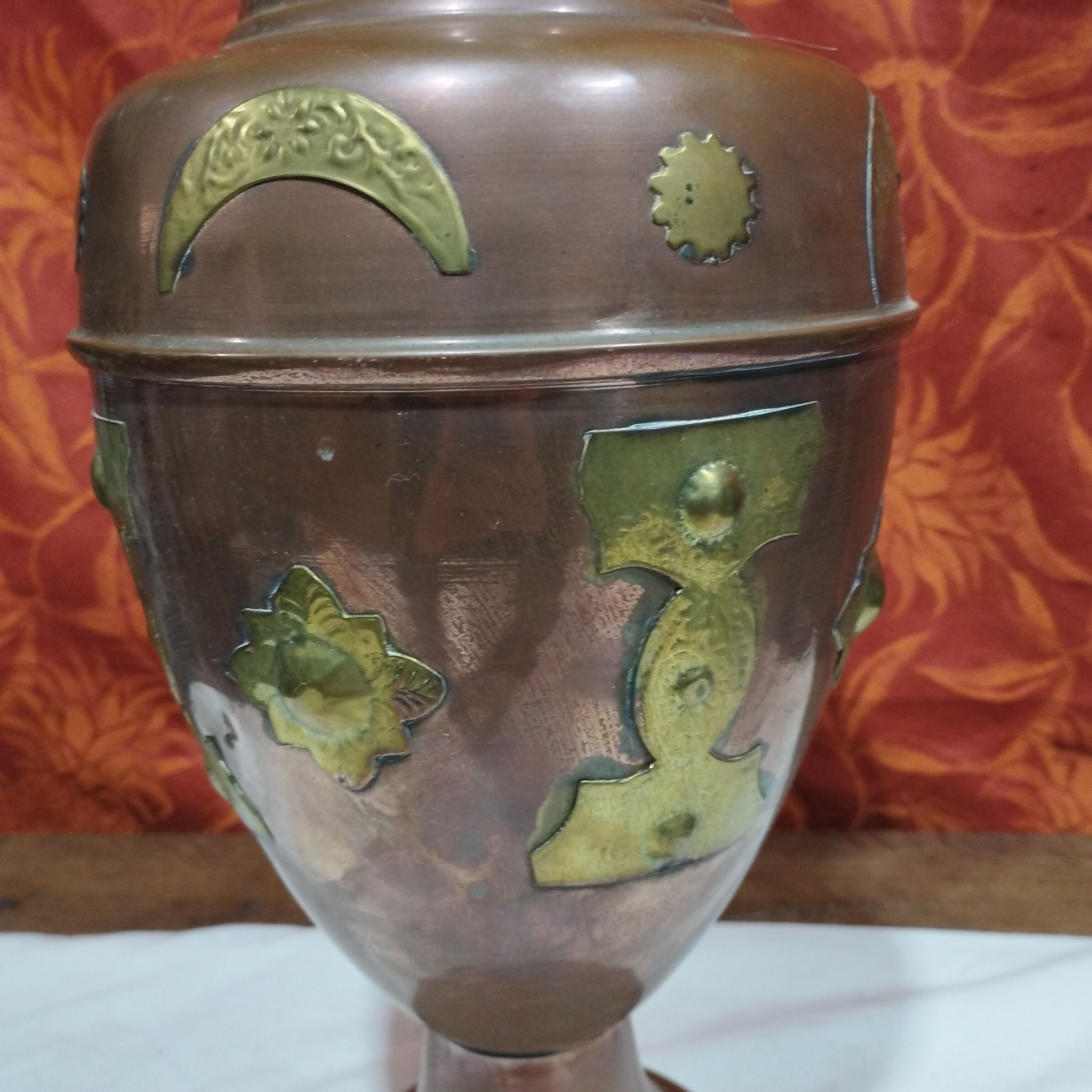 Oriental style vase or copper amphora and brass decoration