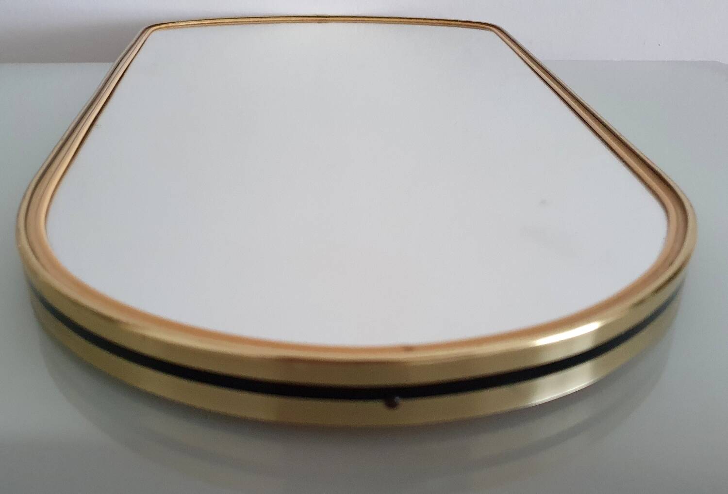 Large vintage ovoid mirror with gold and black edges - 1960s