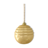 Pale yellow opaline ball suspension