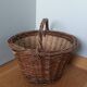 Woven wicker basket with handle