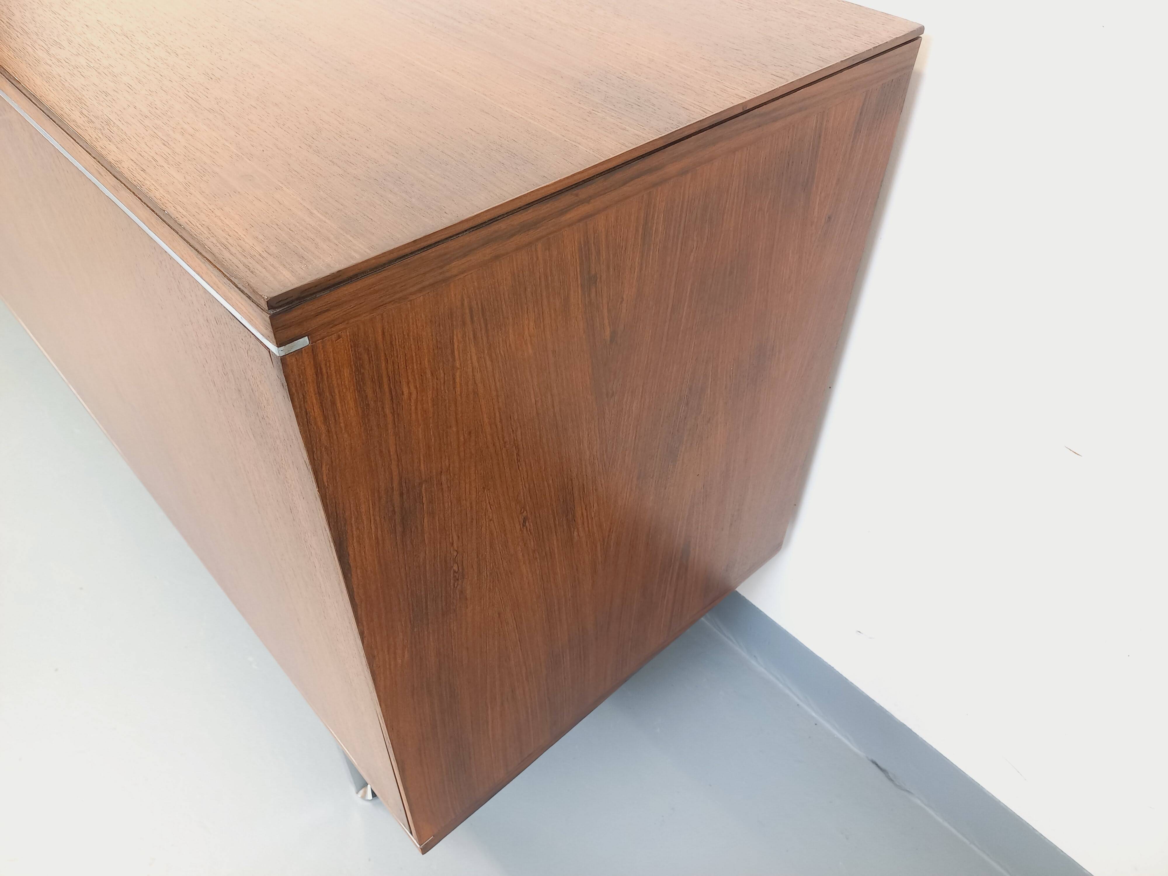 Vintage modernist enfilade in rosewood and chrome metal from the 60s and 70s.