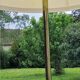Vintage tripod floor lamp from the 60s in wood and brass