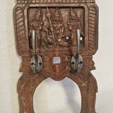 Coat rack with 2 hooks on a frieze of divinities in teak
