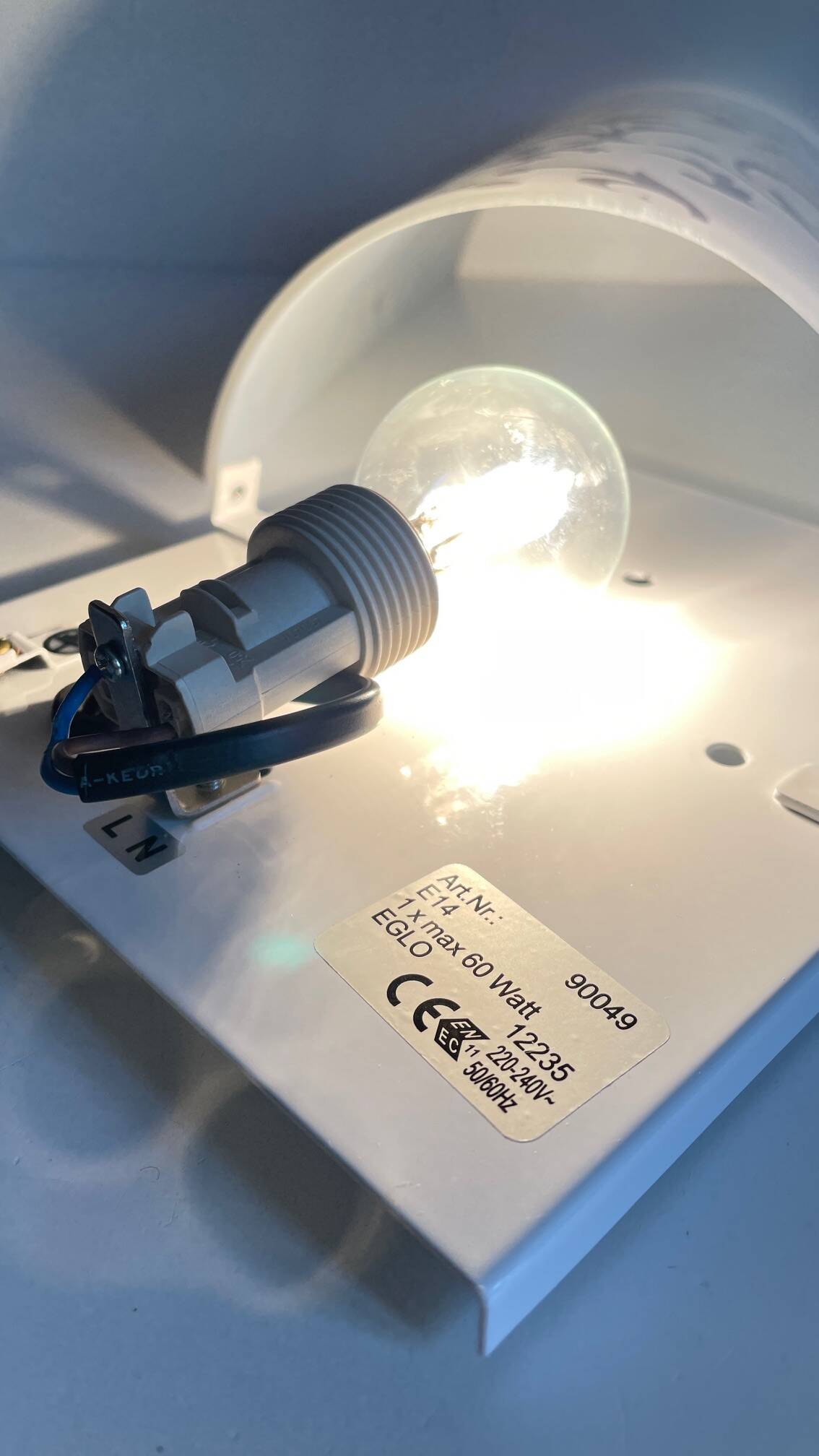 Polished and screen-printed glass sconce by eglo