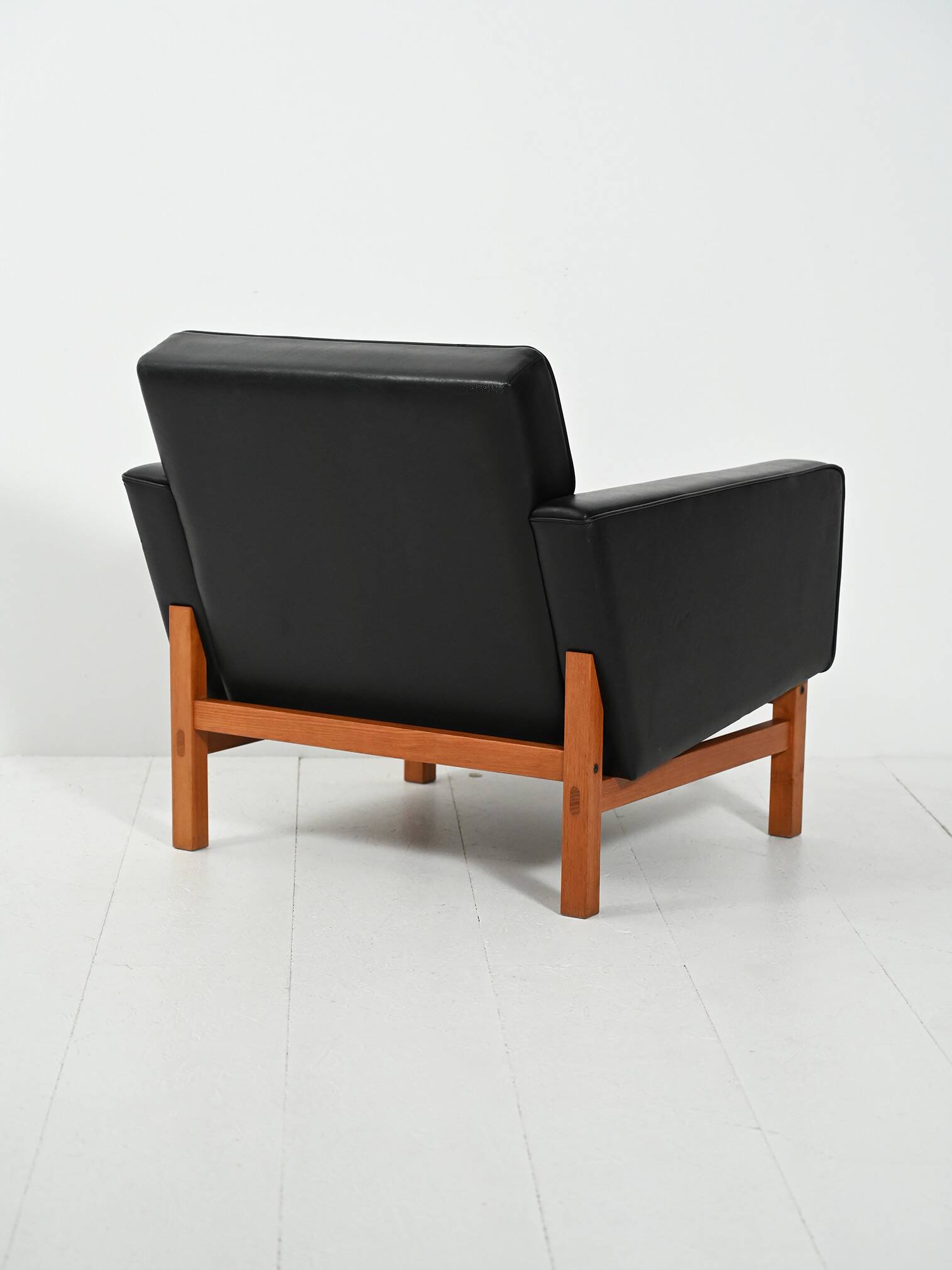 Swedish AB Futura teak and faux leather armchair