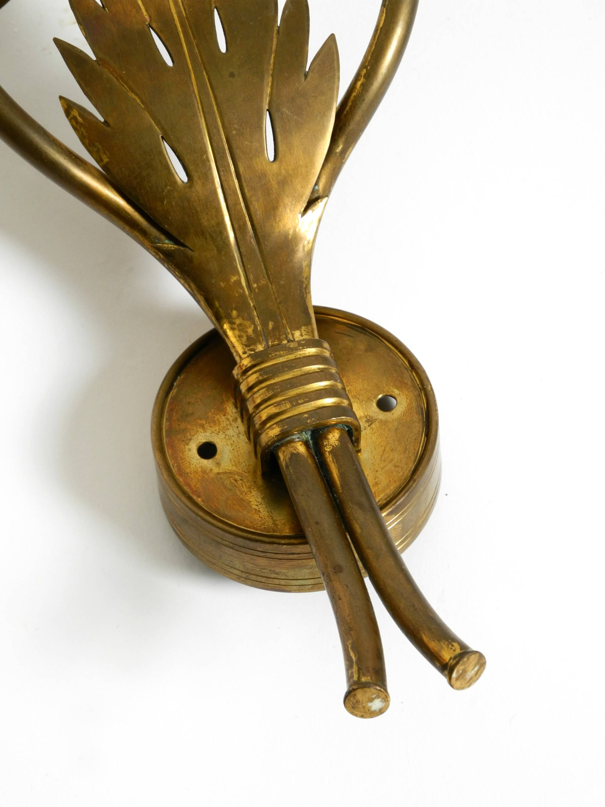 A pair of mid-century modern brass wall lamps by Vereinigte Werkstätten