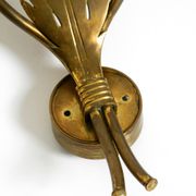 A pair of mid-century modern brass wall lamps by Vereinigte Werkstätten