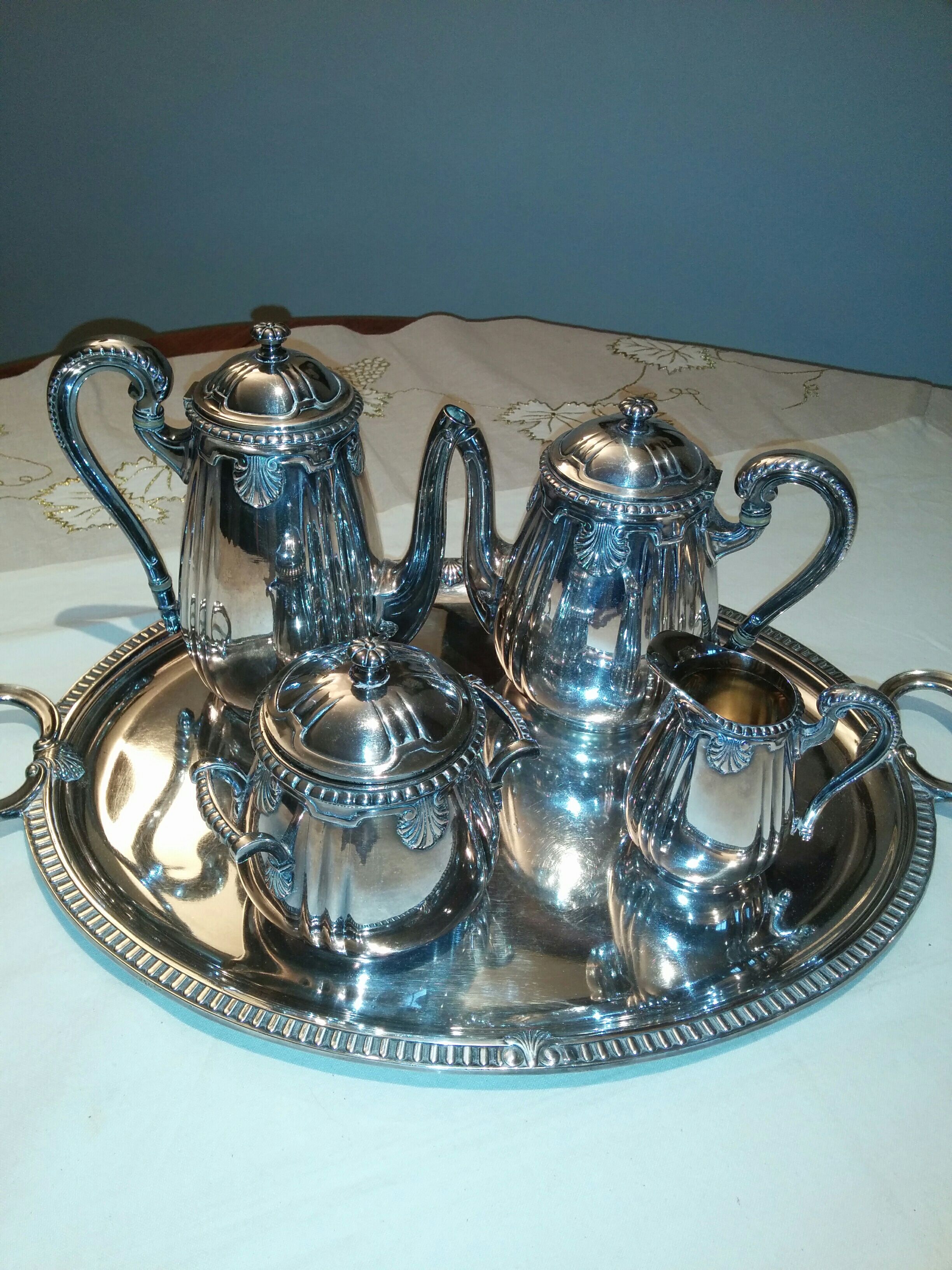Silver metal coffee service with shell-shaped tray