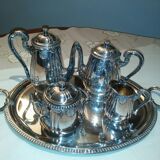 Silver metal coffee service with shell-shaped tray