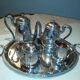 Silver metal coffee service with shell-shaped tray