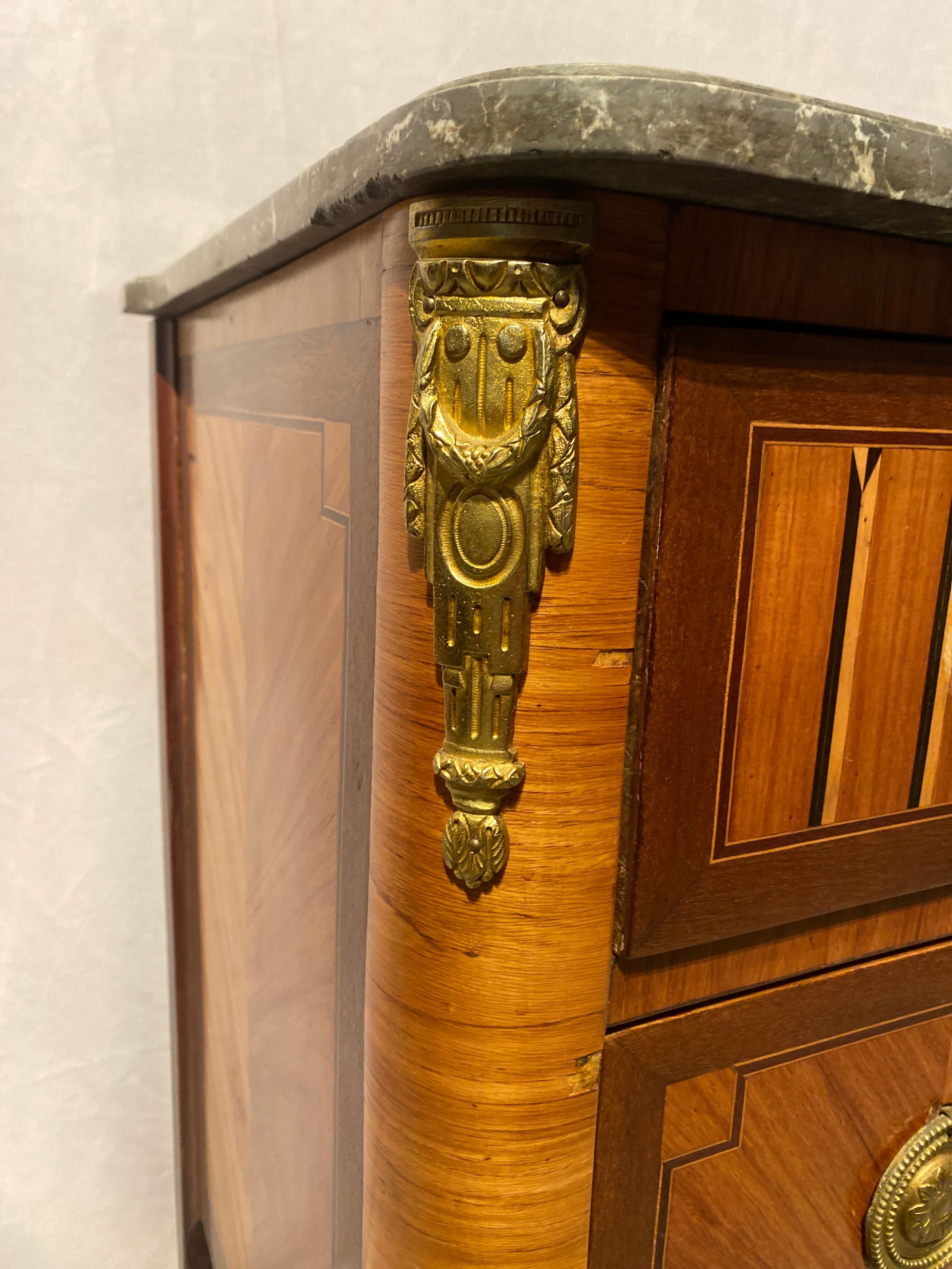 Inlaid chest of drawers with marble top