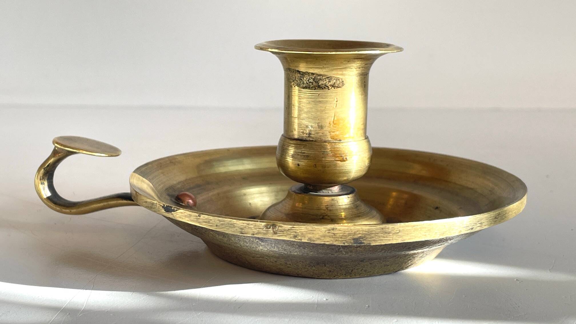 Antique solid bronze hand candlestick