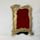 Pair of brass frames with Art Nouveau style woman