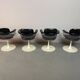 A striking set of four vintage swivel dining chairs