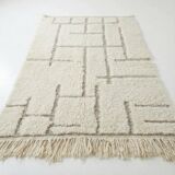 Moroccan rug with black graphic pattern