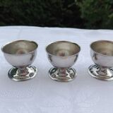 A set of 3 egg cups by Guy Degrenne.