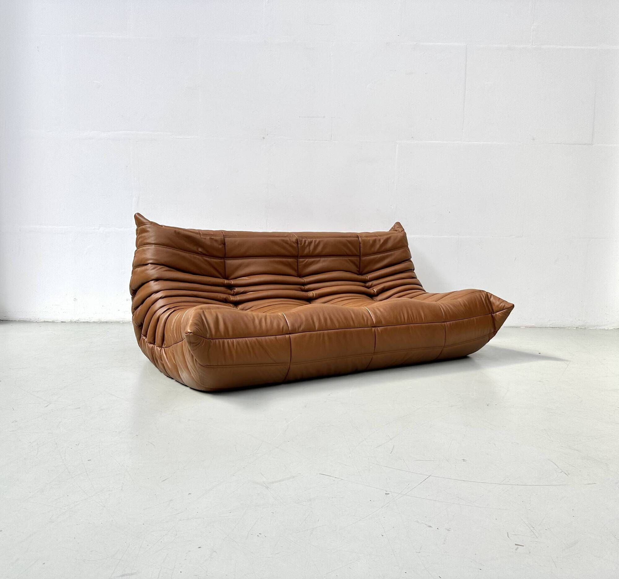 Togo 3-seater in Cognac leather designed by Michel Ducaroy for Ligne Roset.