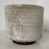 Traditional raku ceramic tea or matcha bowl with mark on the base