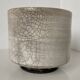Traditional raku ceramic tea or matcha bowl with mark on the base