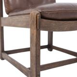 Pair of oak armchairs, upholstered in leather. Work from the 1960s.