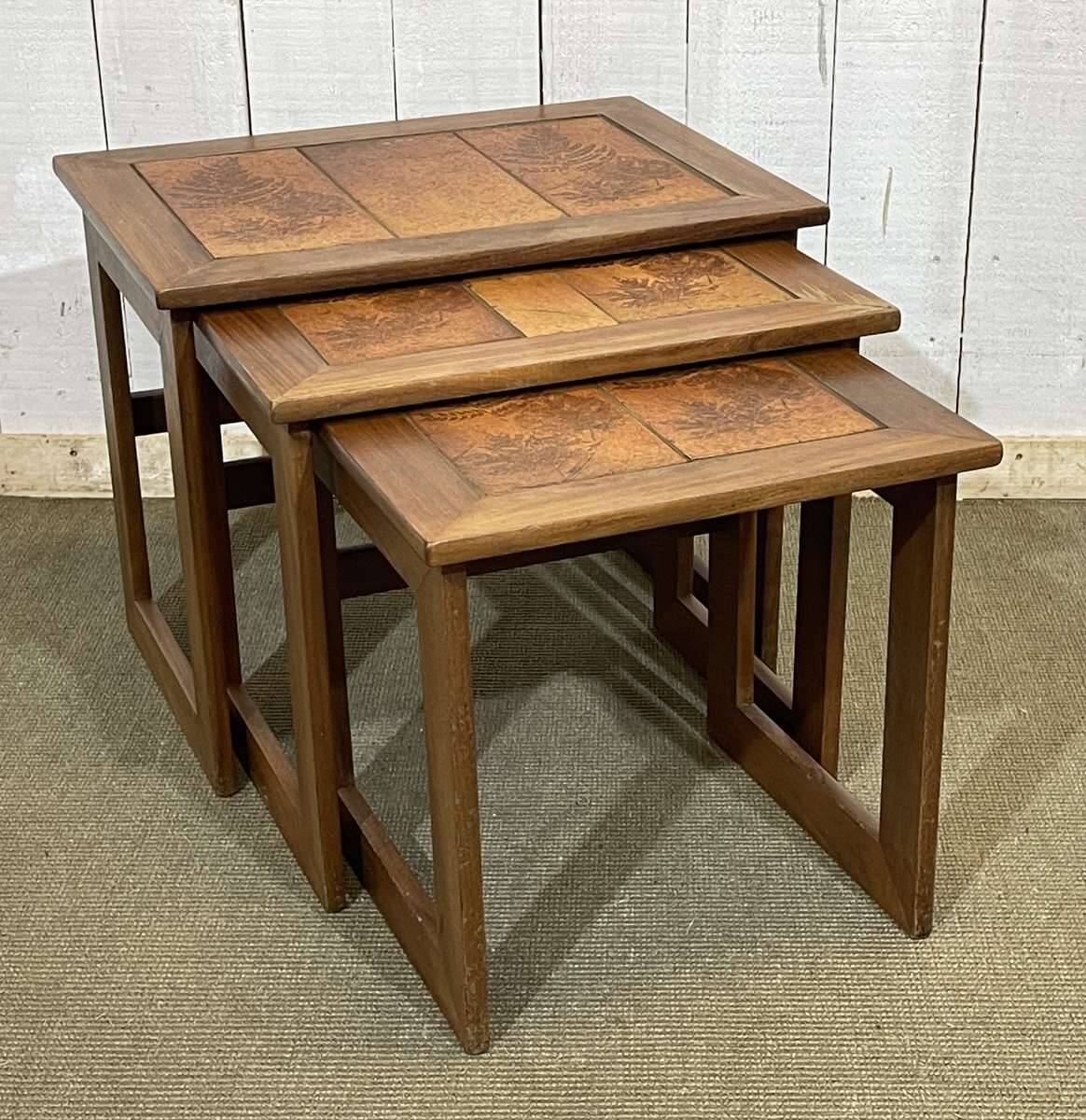 Set of 3 nesting tables in teak with tiled tops.